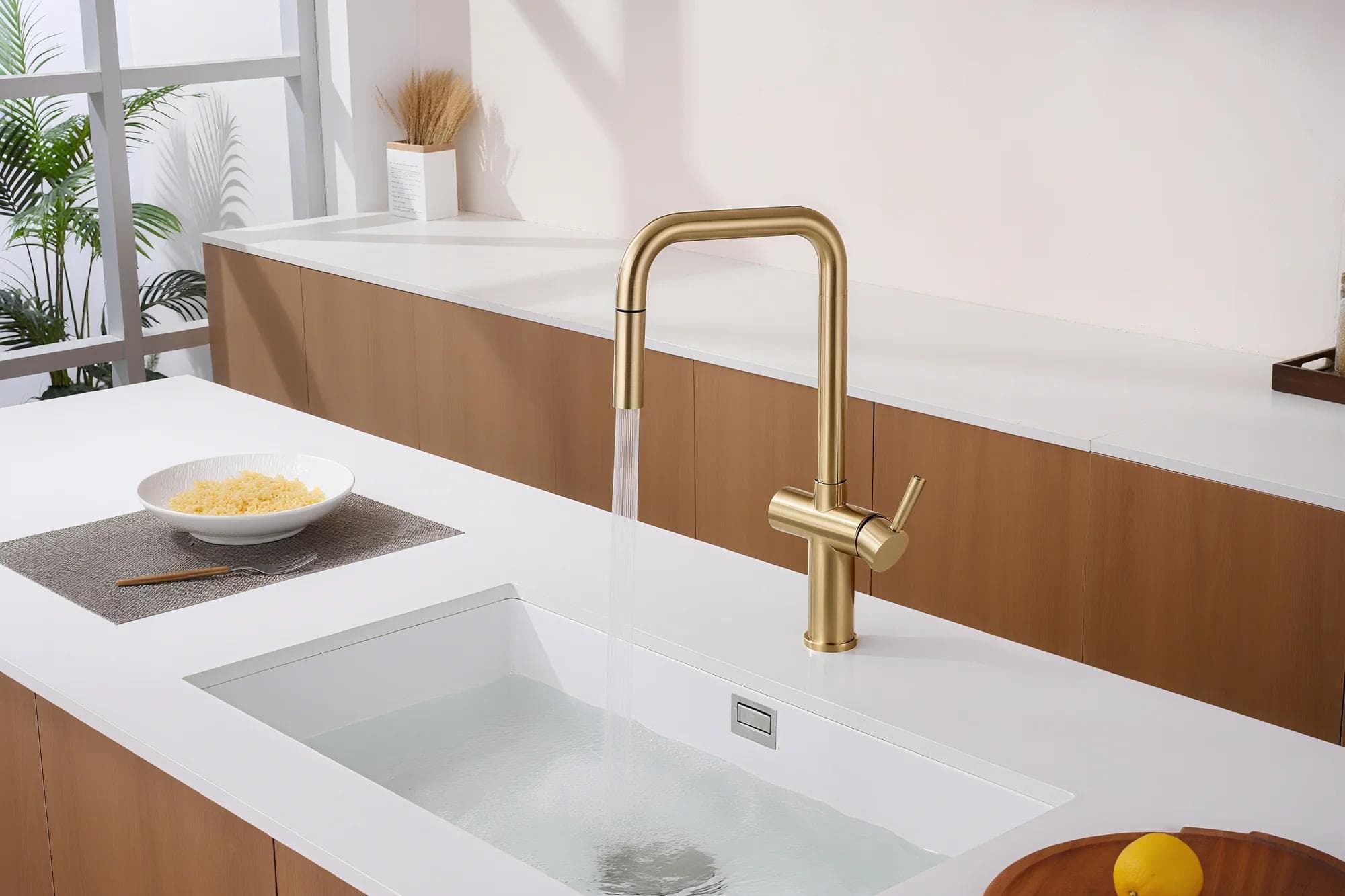 Brushed gold SUS304 kitchen faucet installed in a modern kitchen